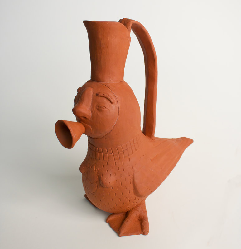 a terra cotta pouring pot in the shape of a siren with a cone on her mouth based on a pouring pot in the harvard museum. 