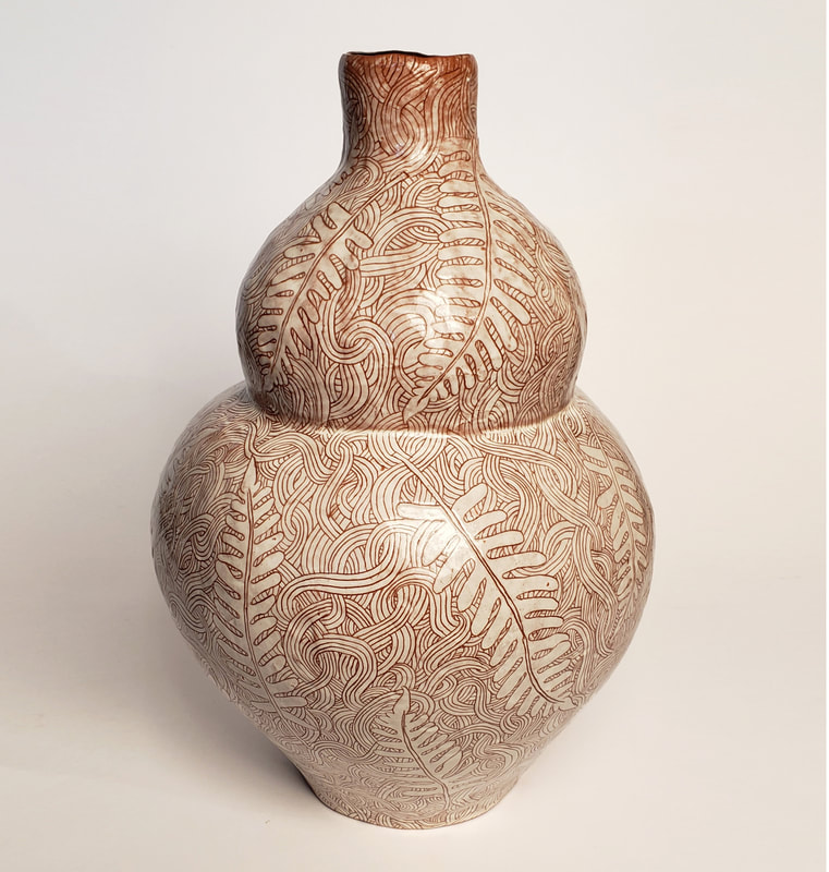 gourd vase with sgraffito decoration of ferns.